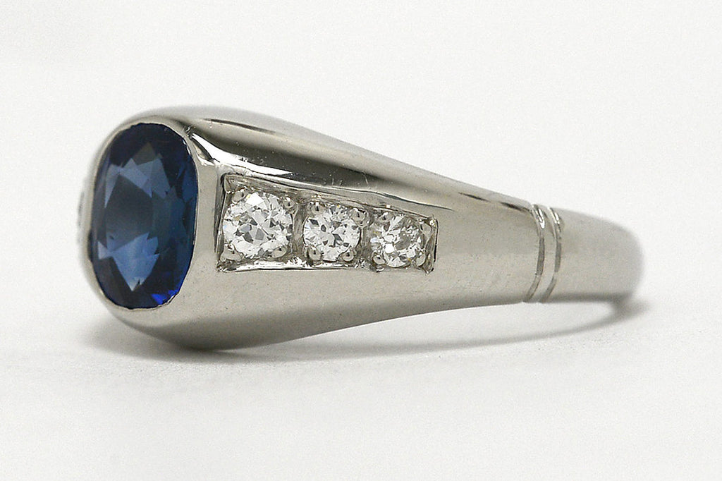 A 1930s cushion cut sapphire ring with six accent diamonds.