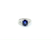 A three carat ceylon blue sapphire engagement ring with 2 diamonds.