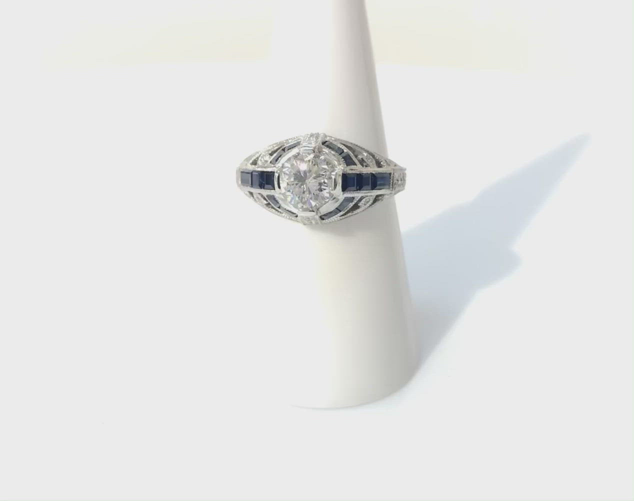 This unique Art Deco engagement ring has blue sapphire stripes.