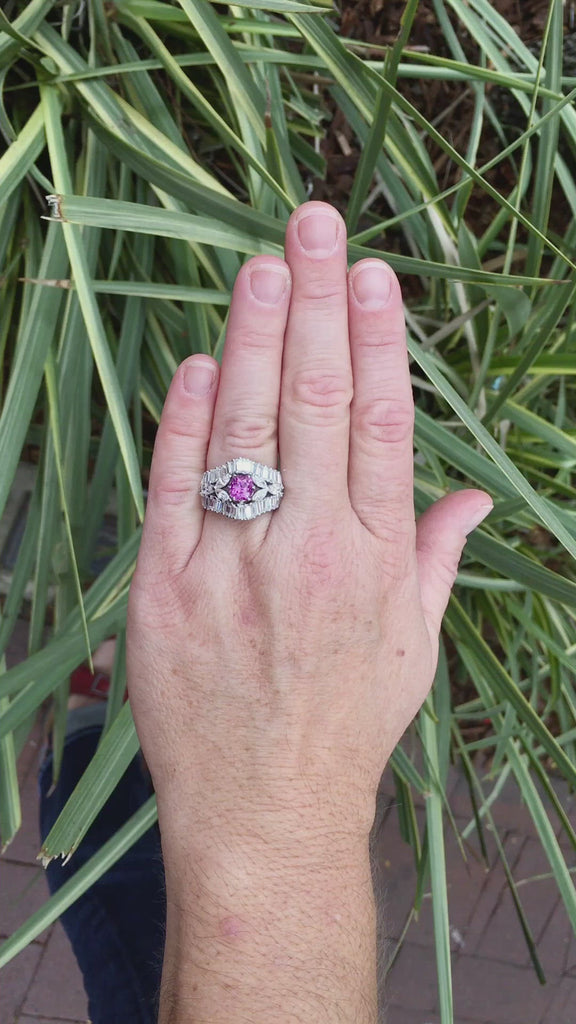 An antique cushion pink sapphire and diamond engagement ring by designer Yanes.