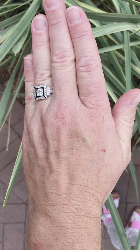 An old European diamond wedding ring with black enamel accents.