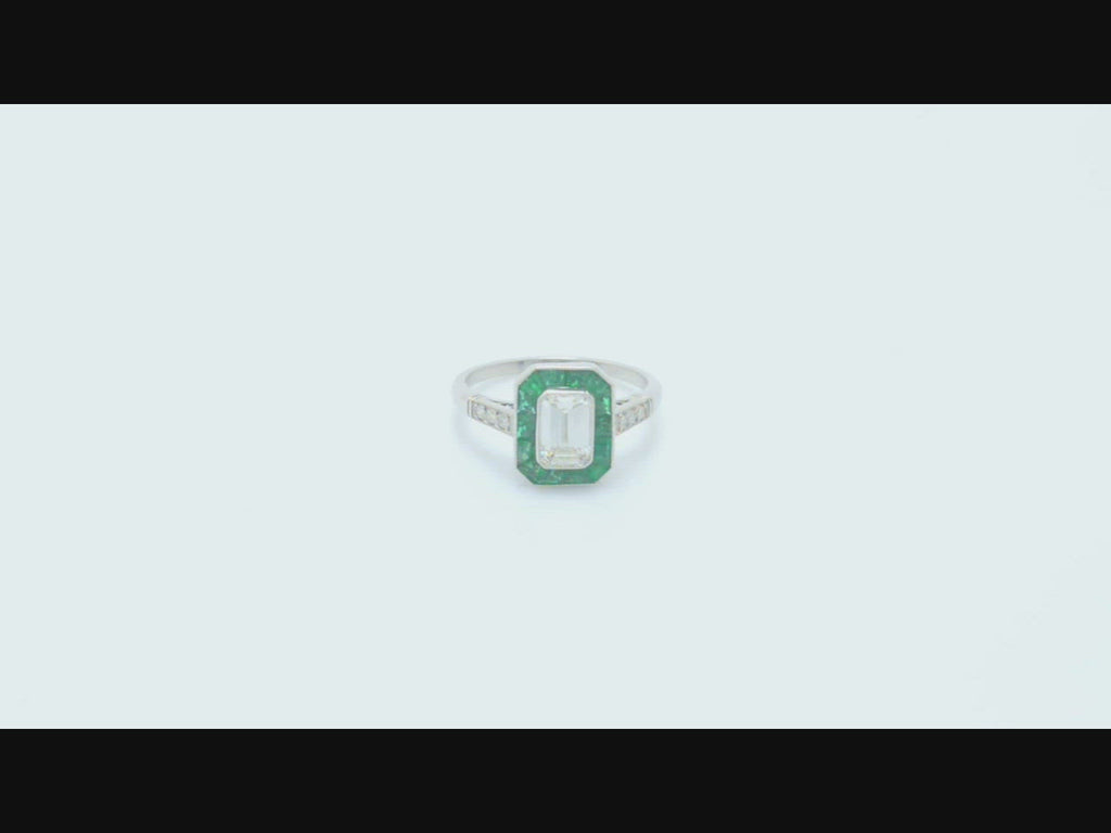 A symmetrical, rectangular geometric emerald cut diamond engagement ring.