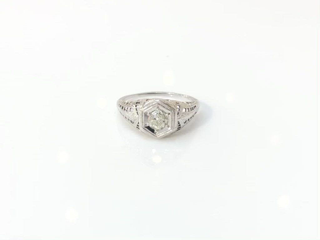A six prong white gold Edwardian diamond solitaire ring.