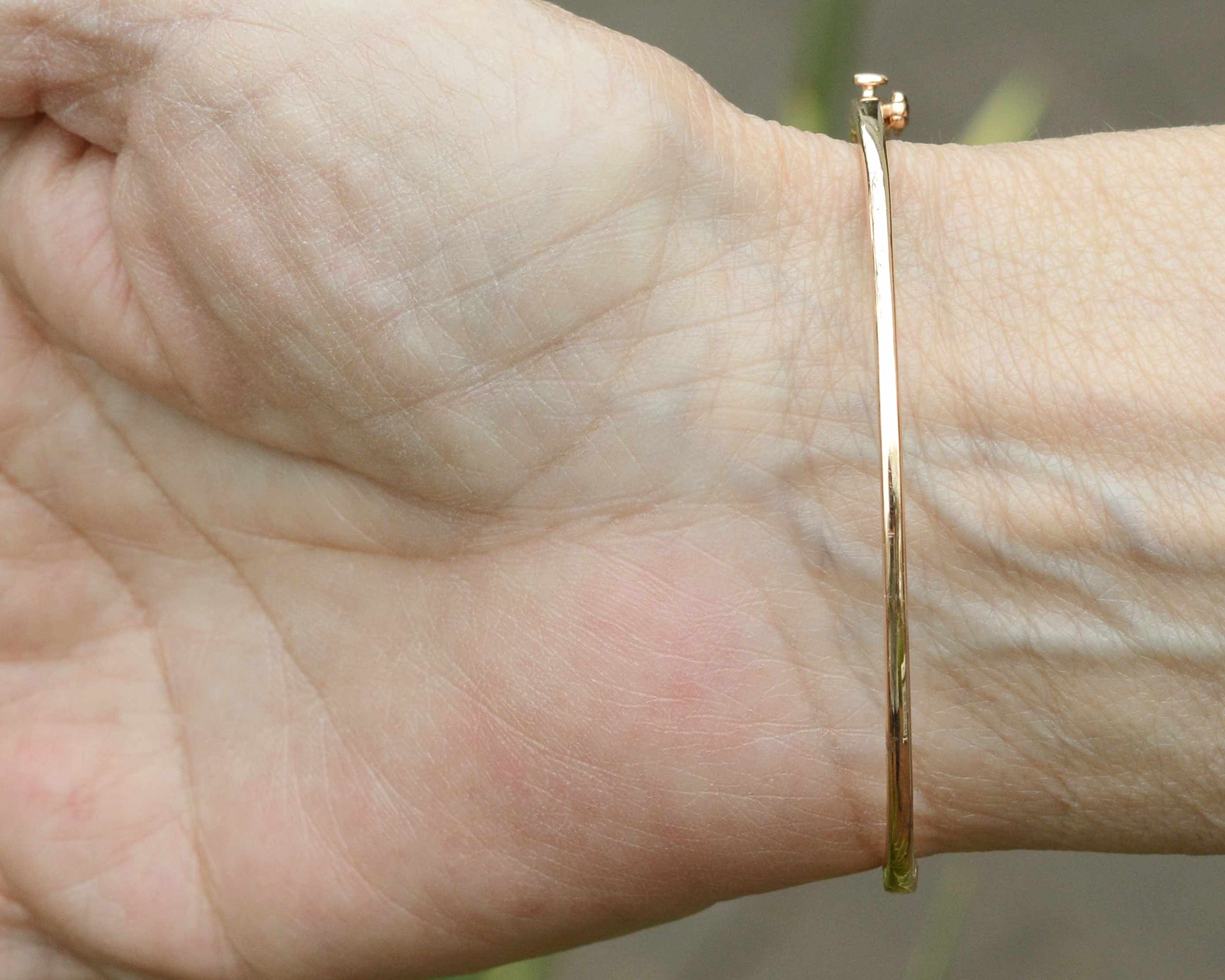 This thin bangle cuff bracelet fits a 7 inch wrist.