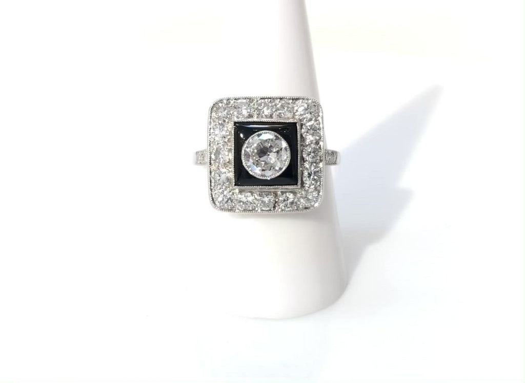 An old European diamond in an square Art Deco engagement ring.