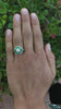 An unique Art deco octagon diamond emerald halo wedding ring.