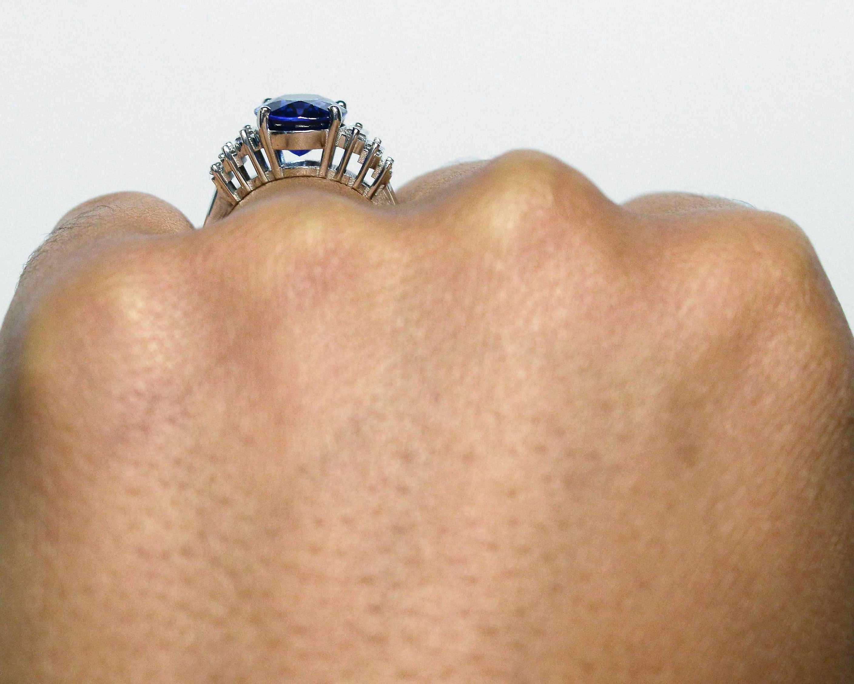 A four carat oval blue sapphire, Art Deco engagement ring.