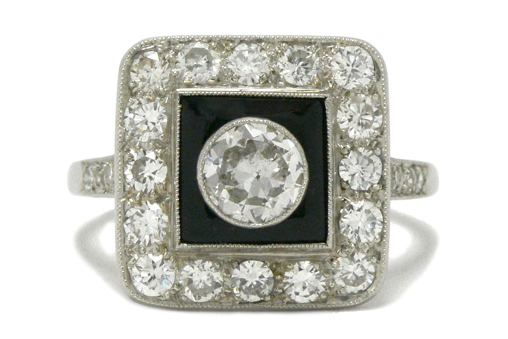 A diamond engagement ring with onyx created in an Art Deco style.