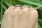 A filigree setting platinum diamond ring.