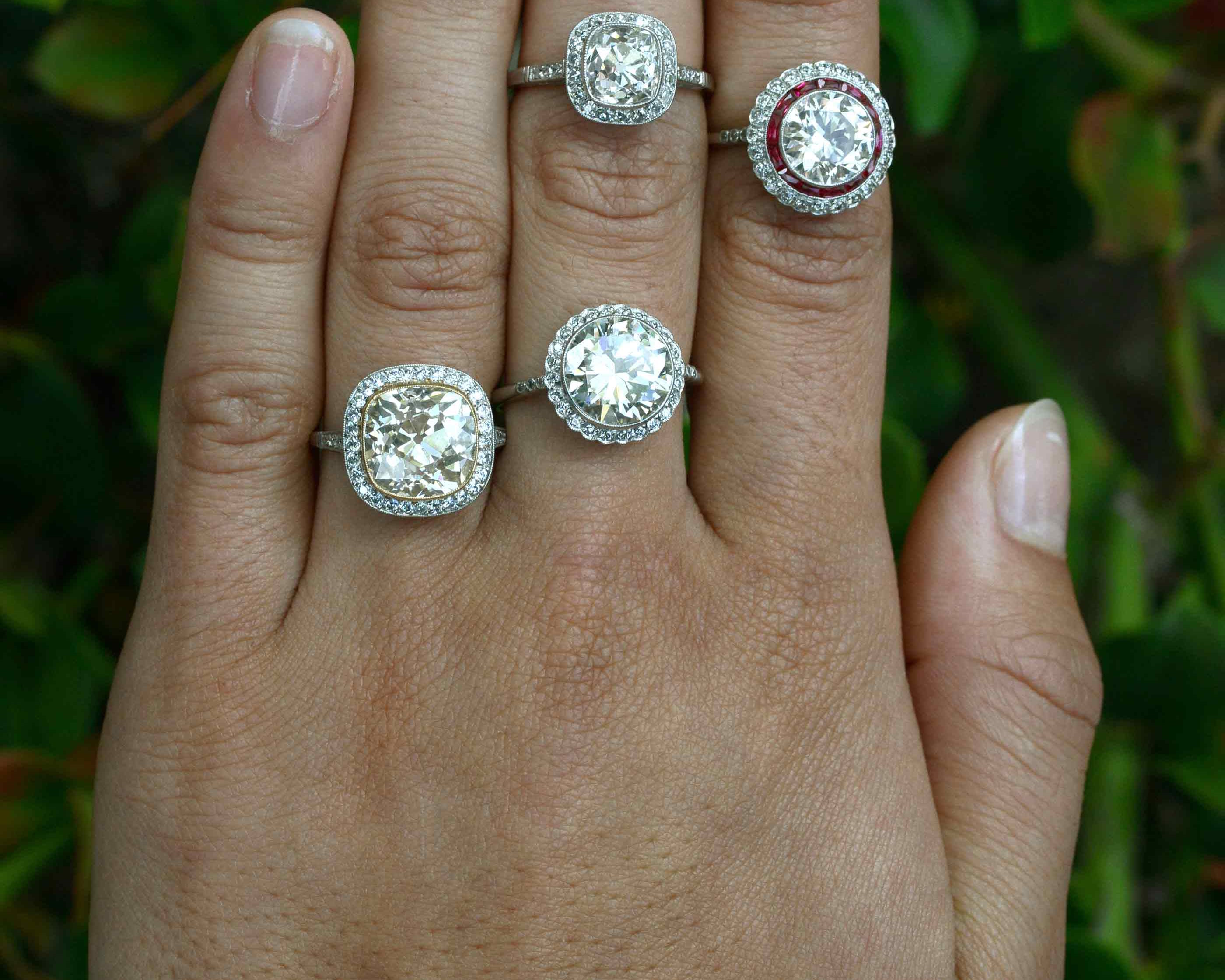 A collection of antique, Edwardian engagement rings.