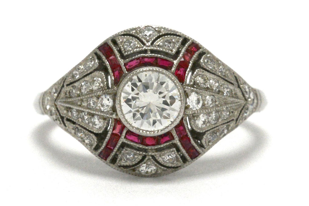 A dome style Edwardian diamonds and rubies engagement ring.