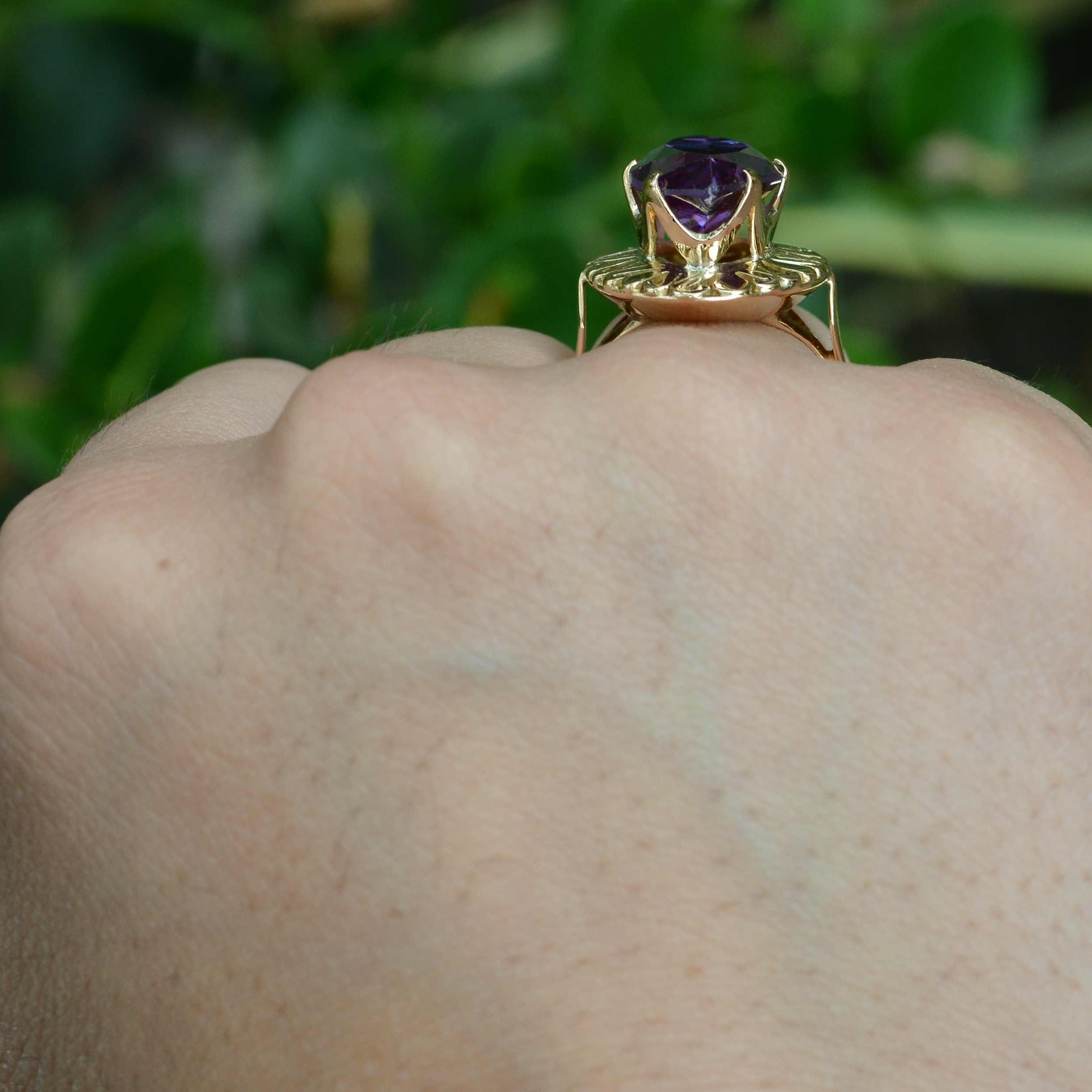 A 1940's, amethyst gold dome ring.