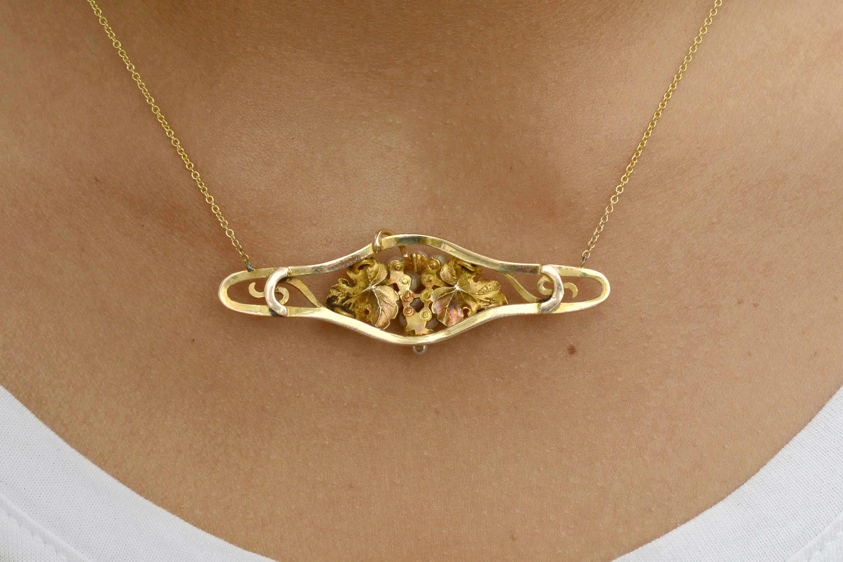 This gold and pearl grape leaf necklace shows great craftsmanship.
