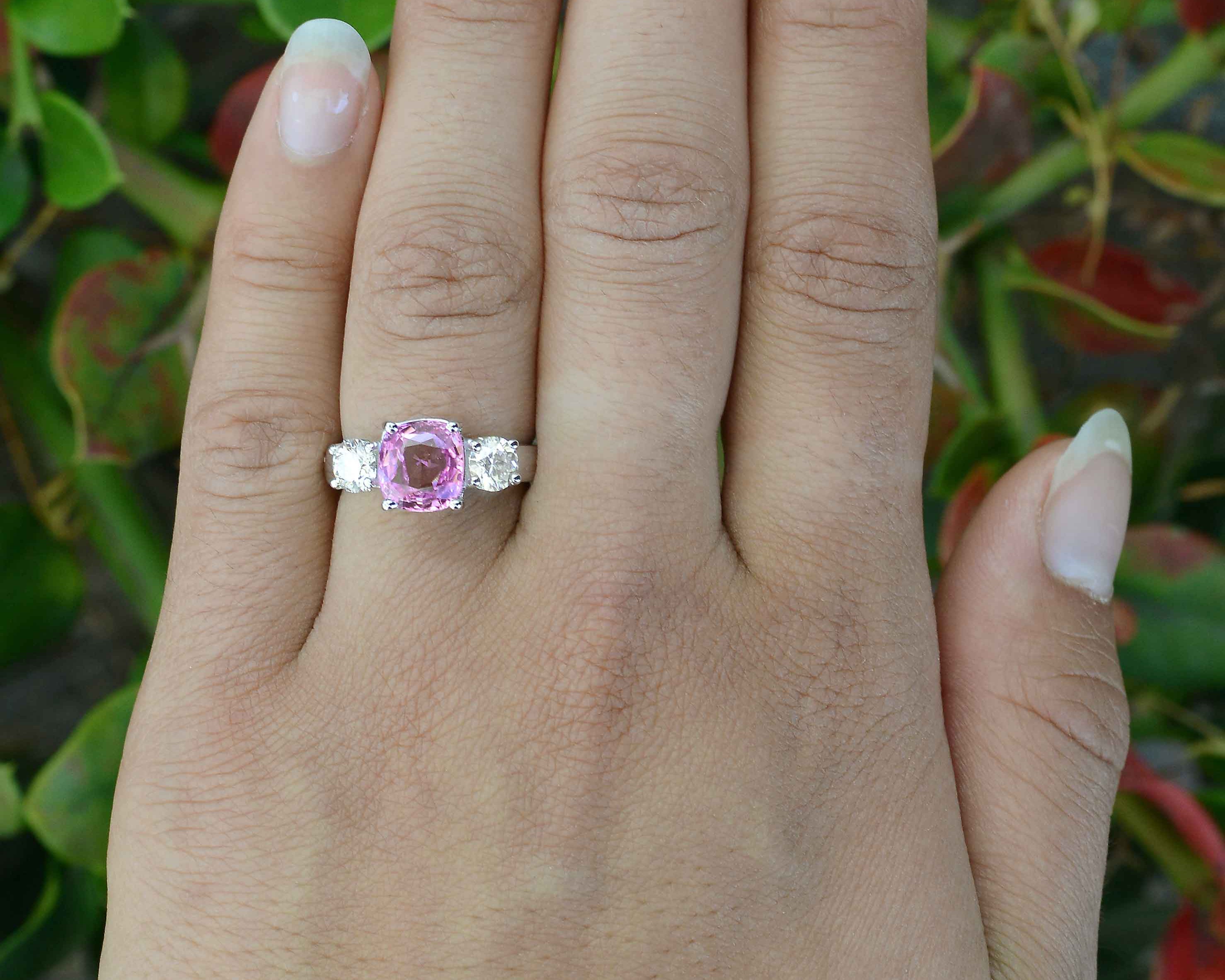 A GIA certified, near 3 carat natural purple pink sapphire with diamonds wedding ring.