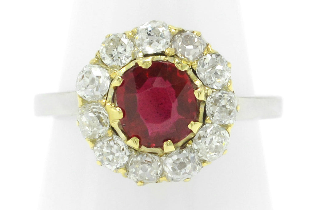 A unique 1 carat ruby engagement ring with over a half carat of old mine diamonds.