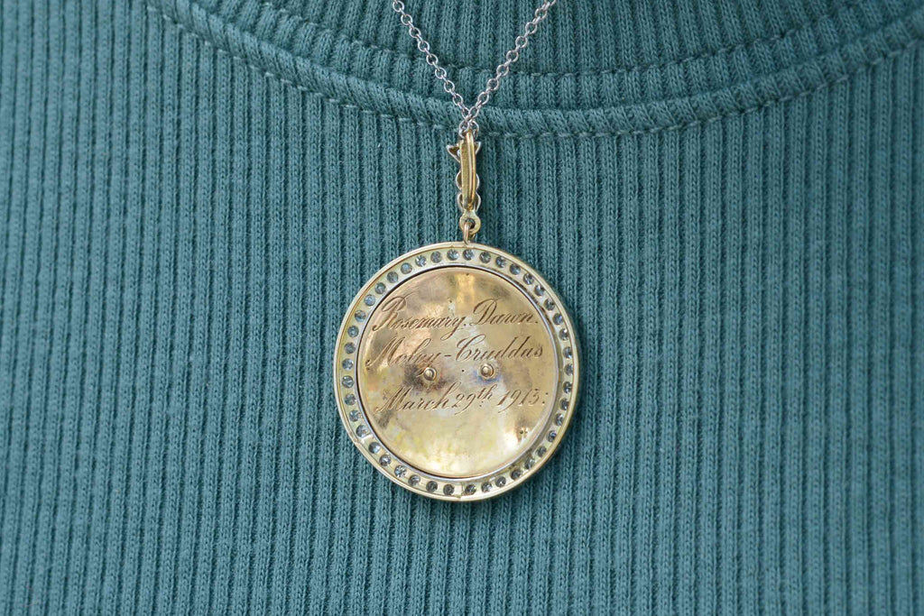 Rich in history, this pendant is hand engraved en verso and dated March 29, 1913.
