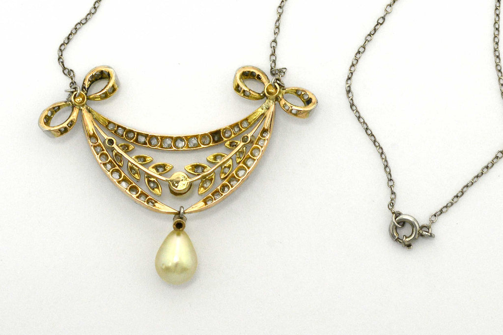 A gold and platinum natural pearl antique necklace.