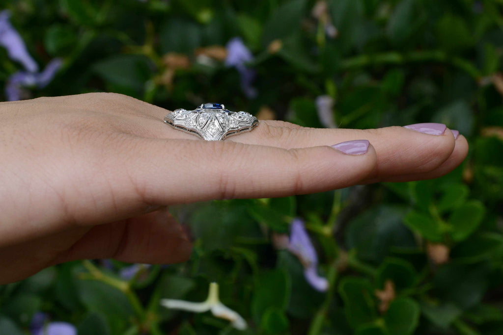 A long, platinum Edwardian diamonds and blue sapphires antique engagement ring.