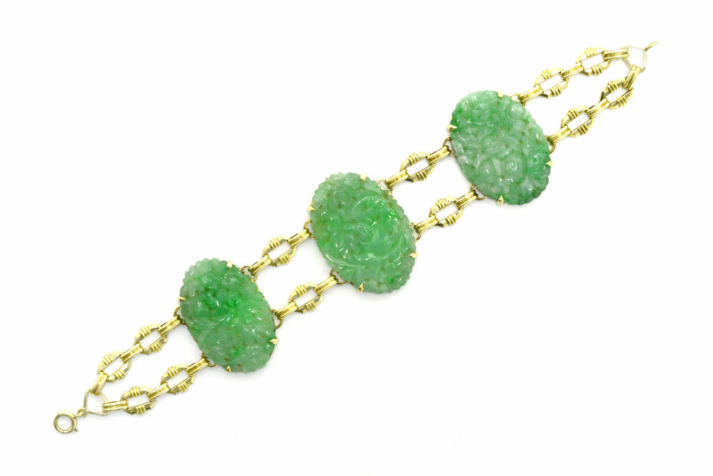 A floral motif, carved jadeite and 14k gold bracelet.