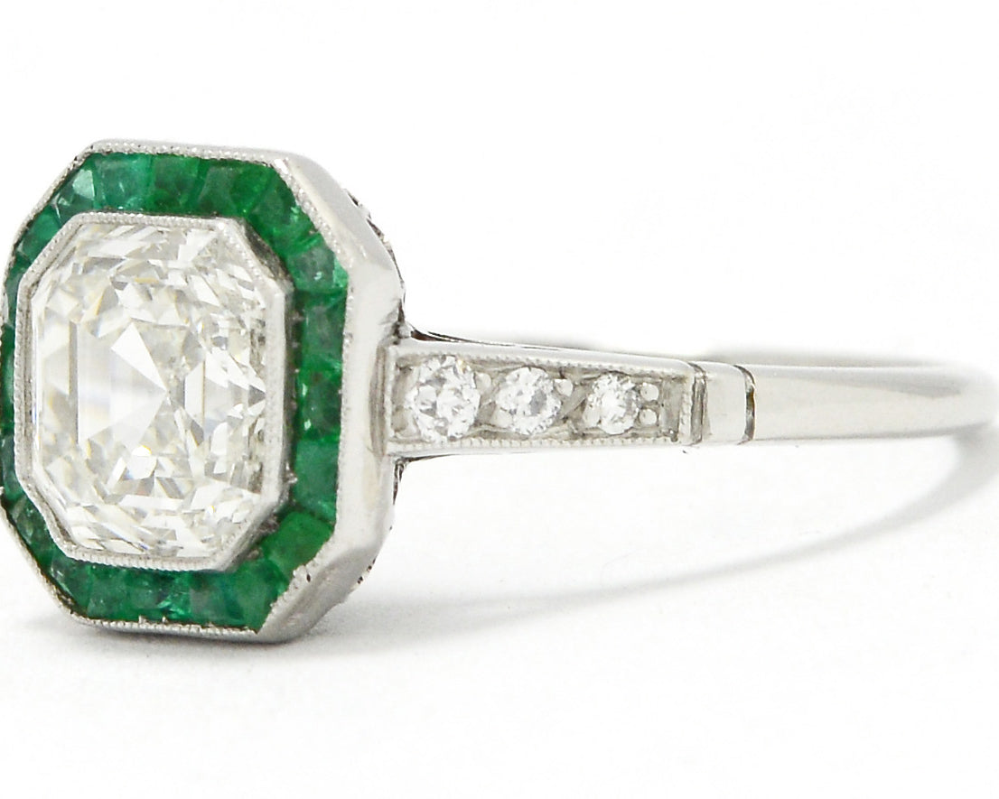 There are three diamonds on the shank of this Art Deco revival wedding ring.