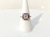 An x design, diamond and ruby platinum wedding ring.