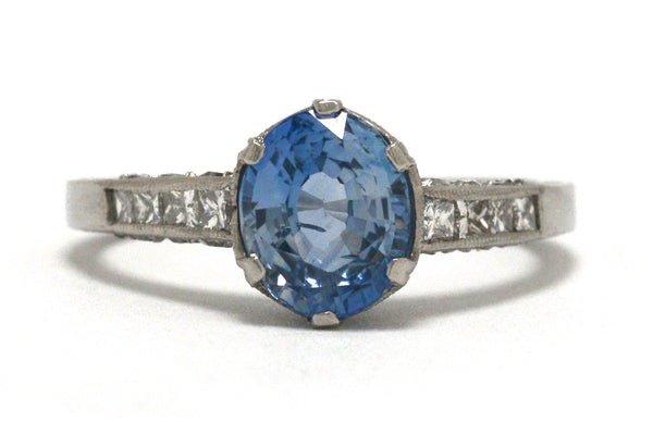 Art Deco inspired ceylon sapphire solitaire engagement ring with diamonds.