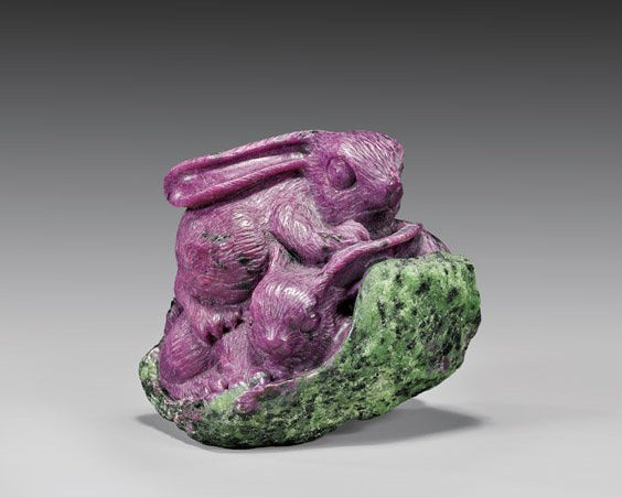 2 bunnies carved out of a rich apple green zoisite gemstone.