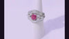 This platinum mid century statement ring holds a one carat pink sapphire center gem.