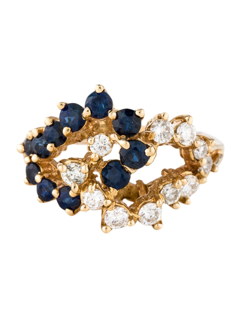 Diamond and blue sapphire gold cluster cocktail ring.