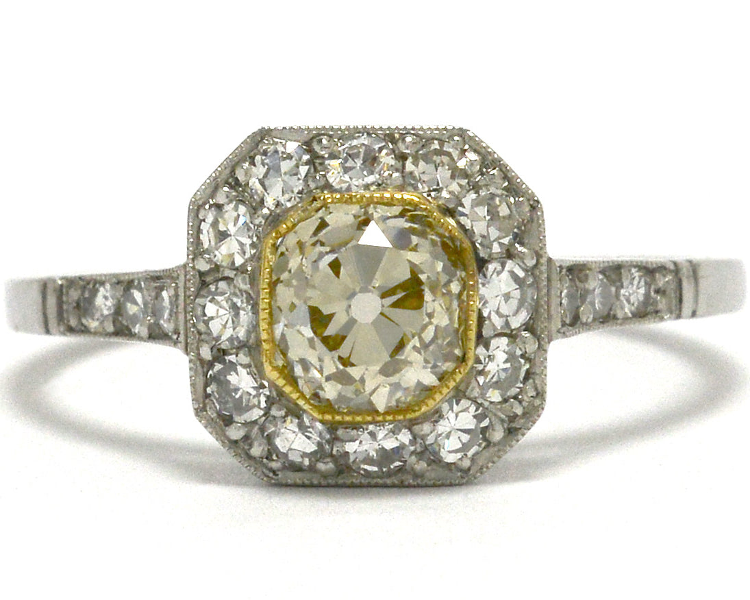 Light yellow old mine diamond engagement ring.