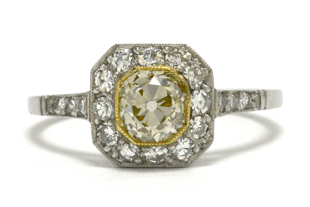 Light yellow old mine diamond engagement ring.