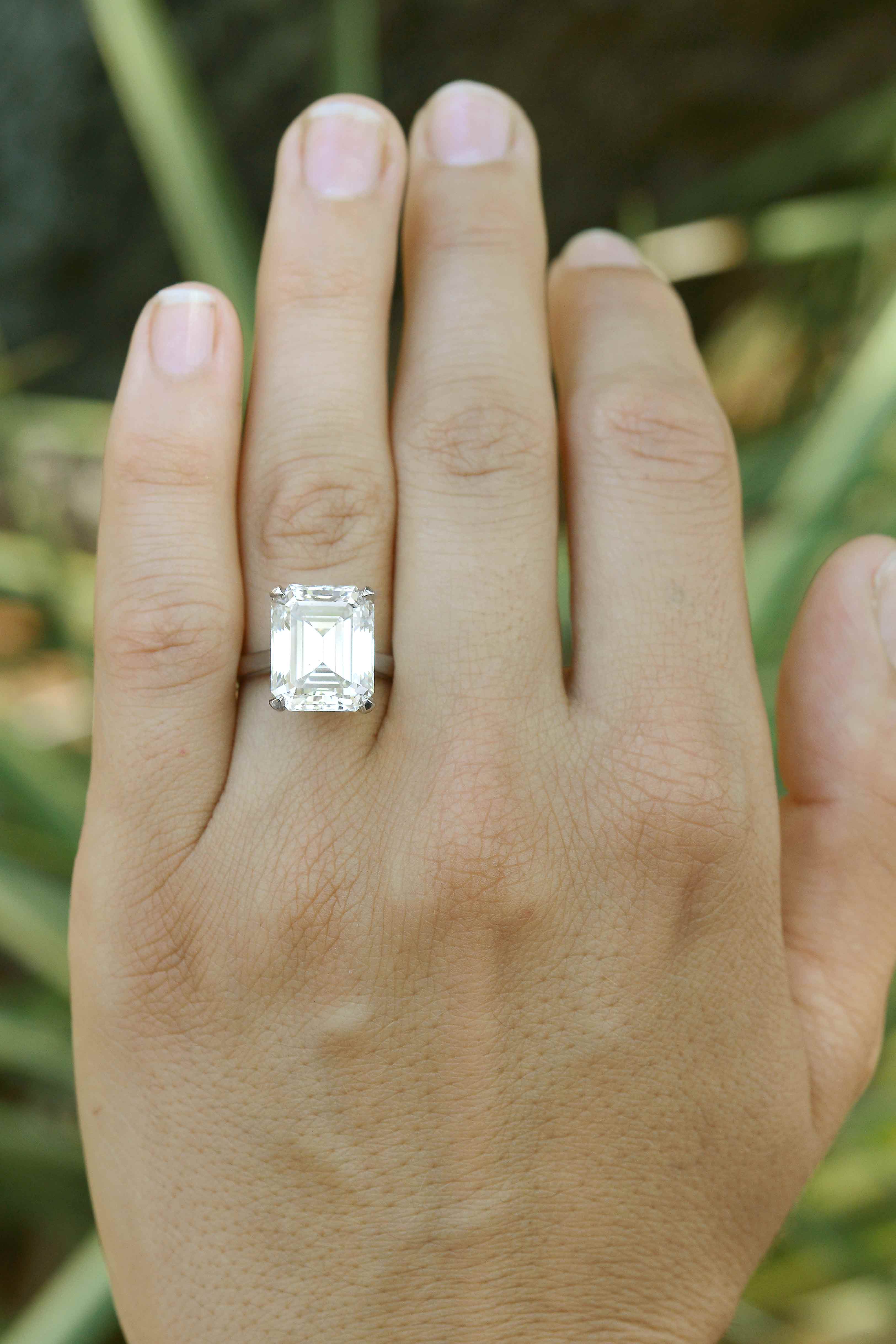 A giant emerald cut diamond set in a 4 prong soltaire setting.