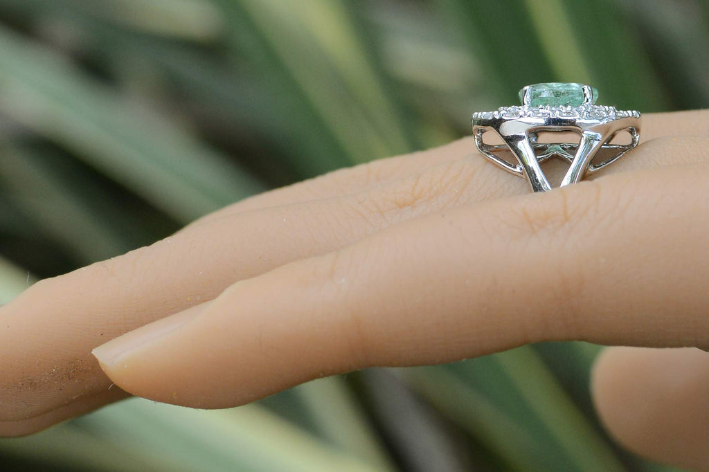 A new, contemporary paraiba tourmaline engagement ring with a double diamond halo.