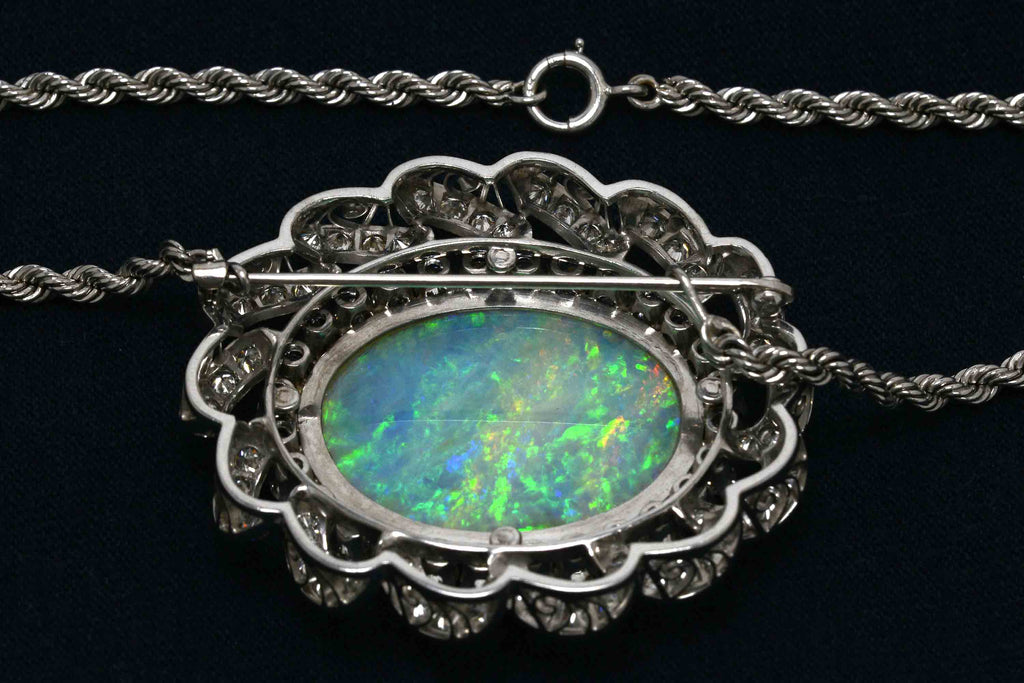This is a fine example of opal and diamond heirloom estate jewelry.
