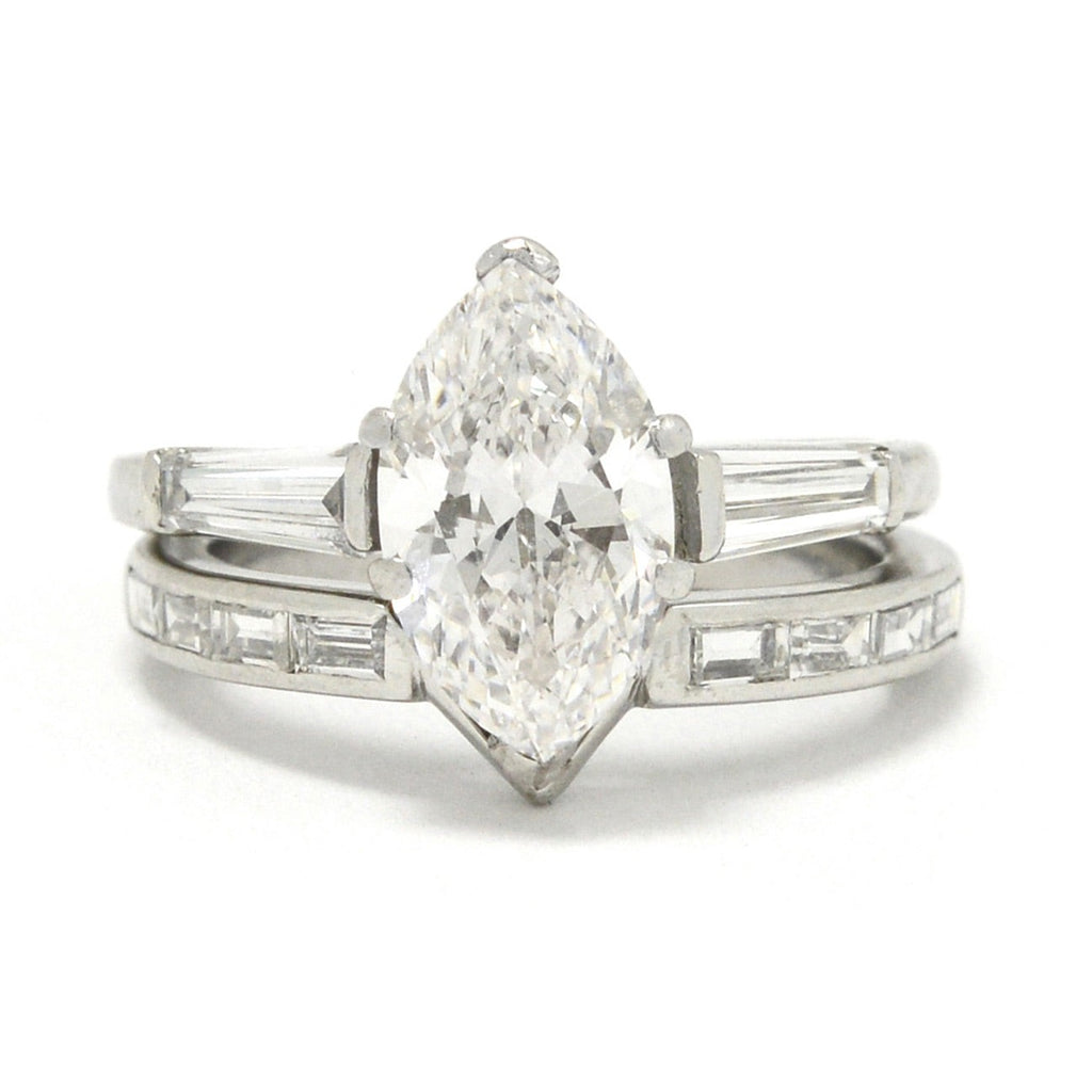 Here is the 2 carat marquise diamond engagement ring nestled in a custom band jacket.