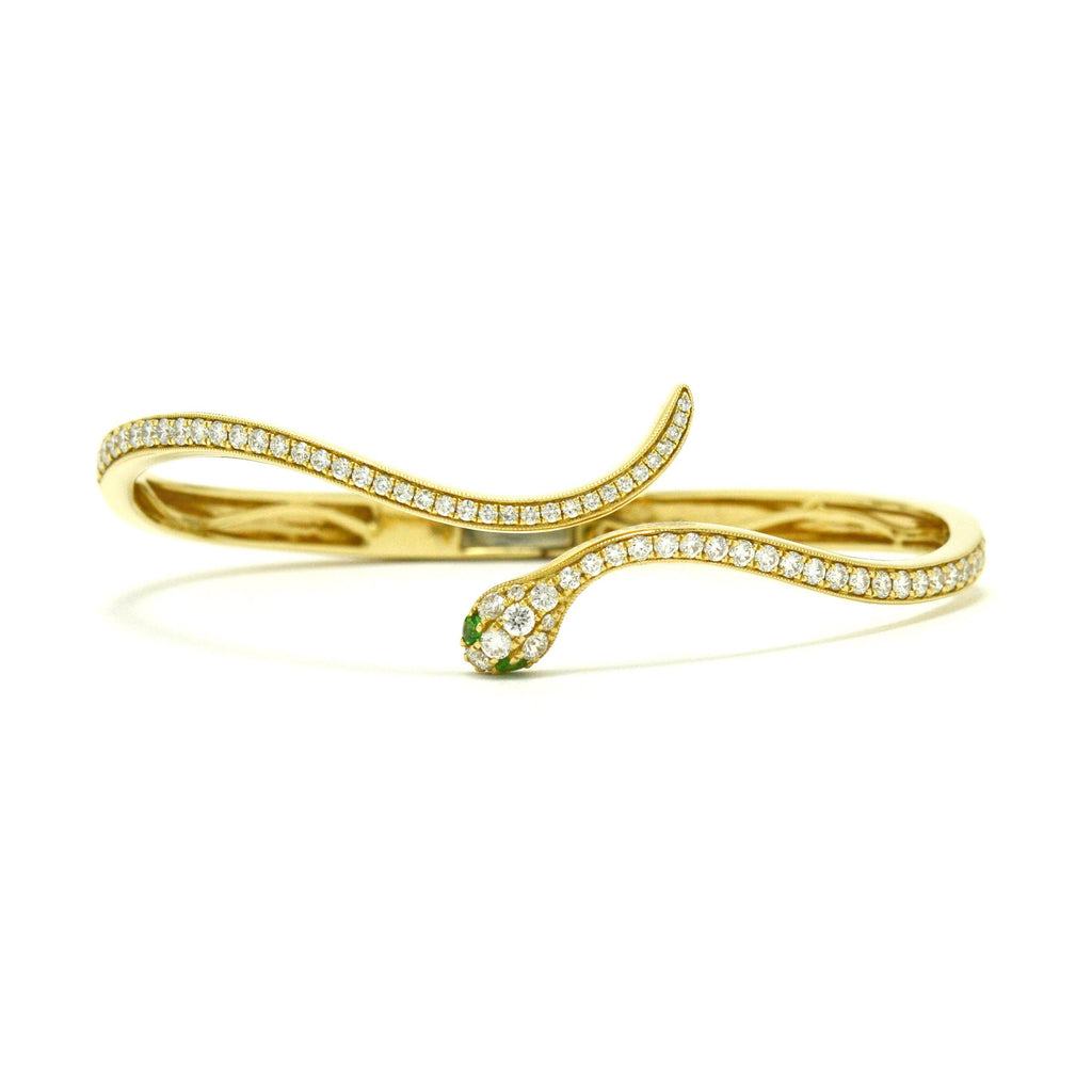 A newly made 14k Egyptian revival snake bangle bracelet with diamonds.