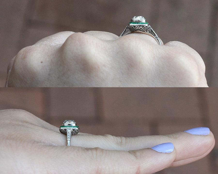 The cushion diamond has a little dome on top of this ring.