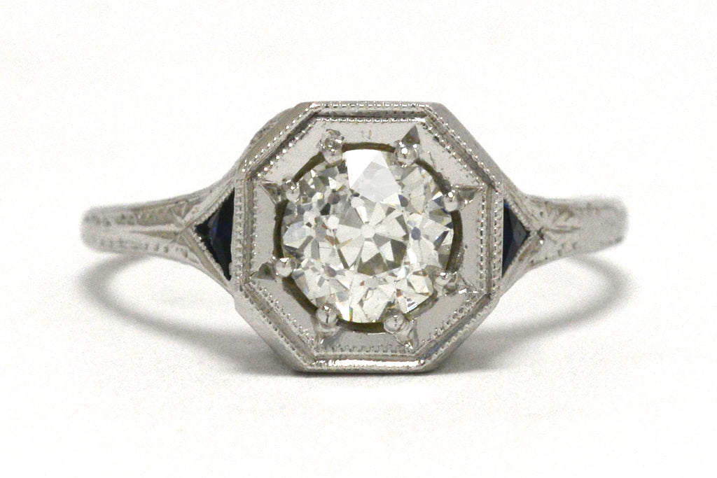 An antique old european diamond three stone engagement ring with sapphires.