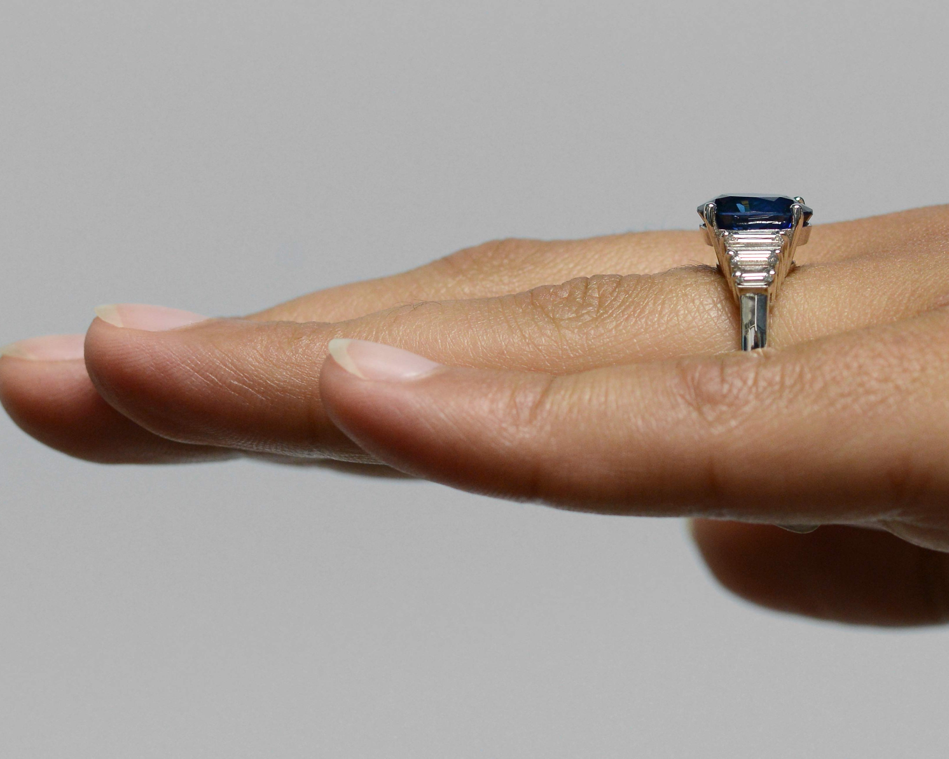 A vivid, royal blue sapphire, 18k white gold engagement ring.