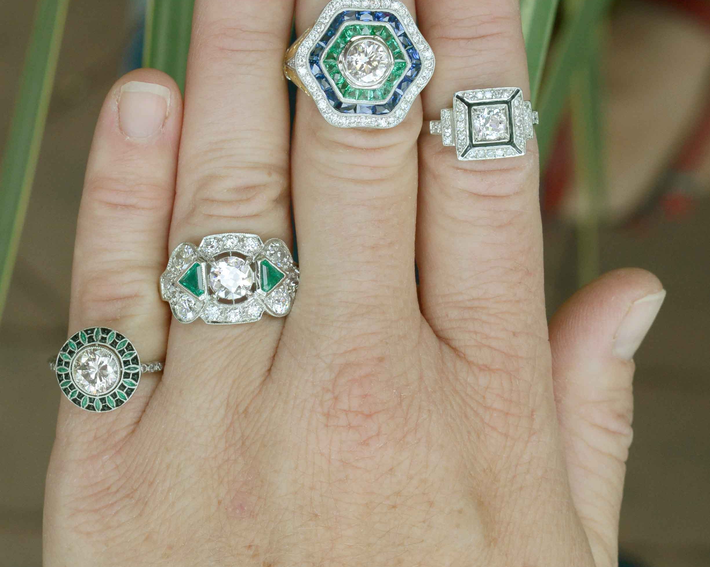 Diamond engagement rings with emeralds.