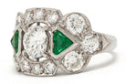 Triangle step cut emeralds diamond engagement ring.