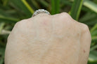 This diamond ring has low rise off the hand.