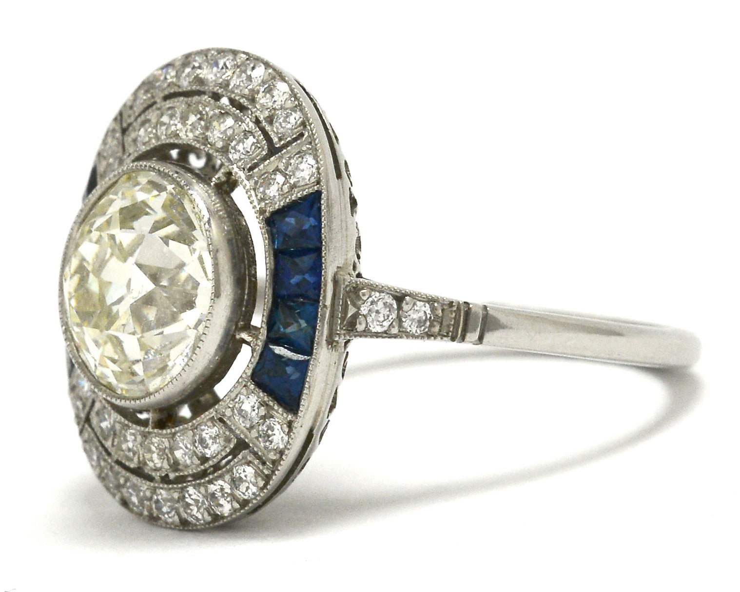 An antique diamond is set in an Art Deco revival engagement ring.