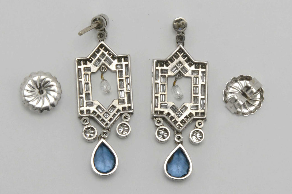 An alhambra design window aqua earrings with a free floating briolette diamond.