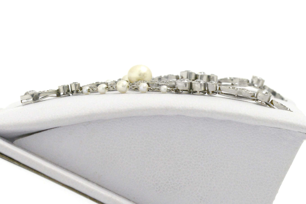 Pearls and diamonds line this filigree platinum Art Nouveau negligee necklace.