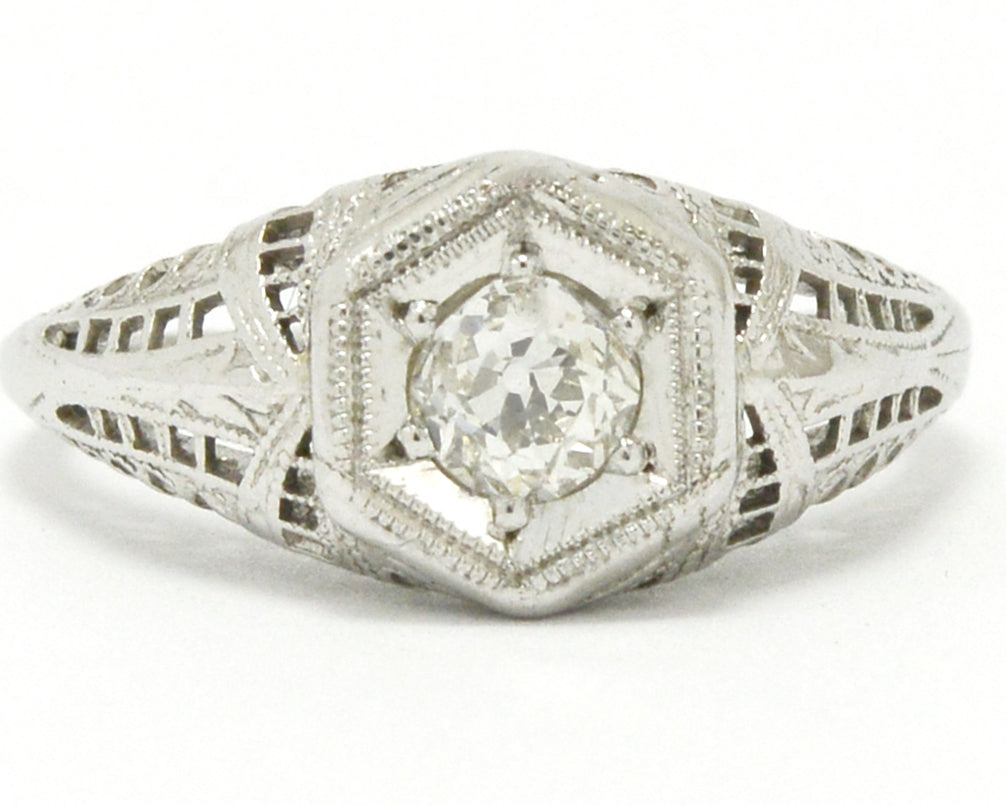 Diamond hexagon filigree 18k white gold engagement ring.