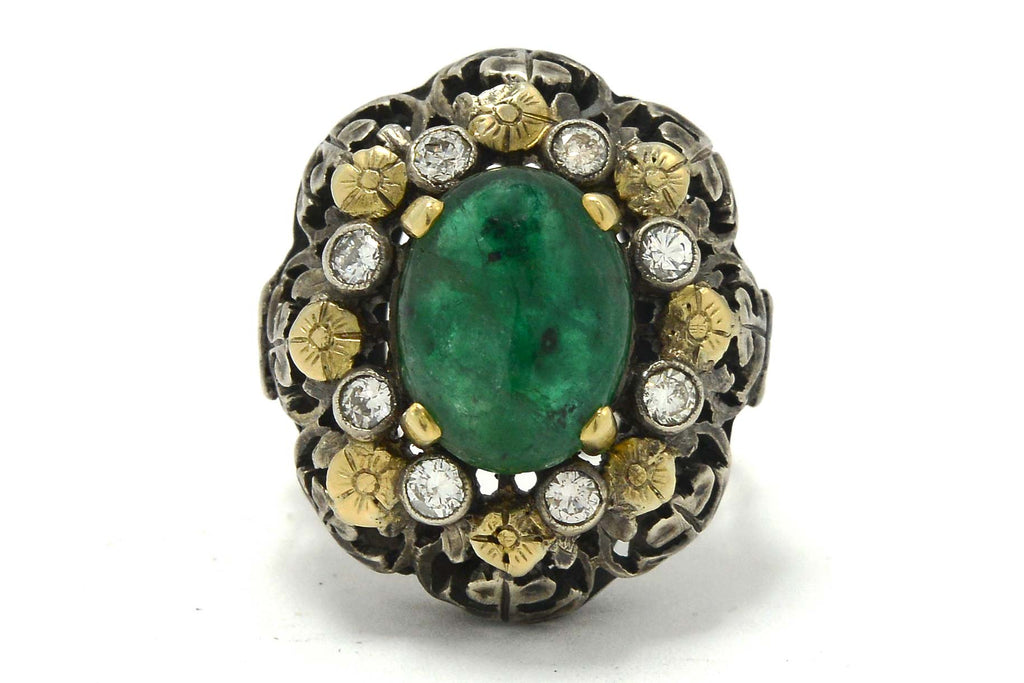 This Victorian antique ring has a 3 carat oval emerald, accented with diamonds and flowers.