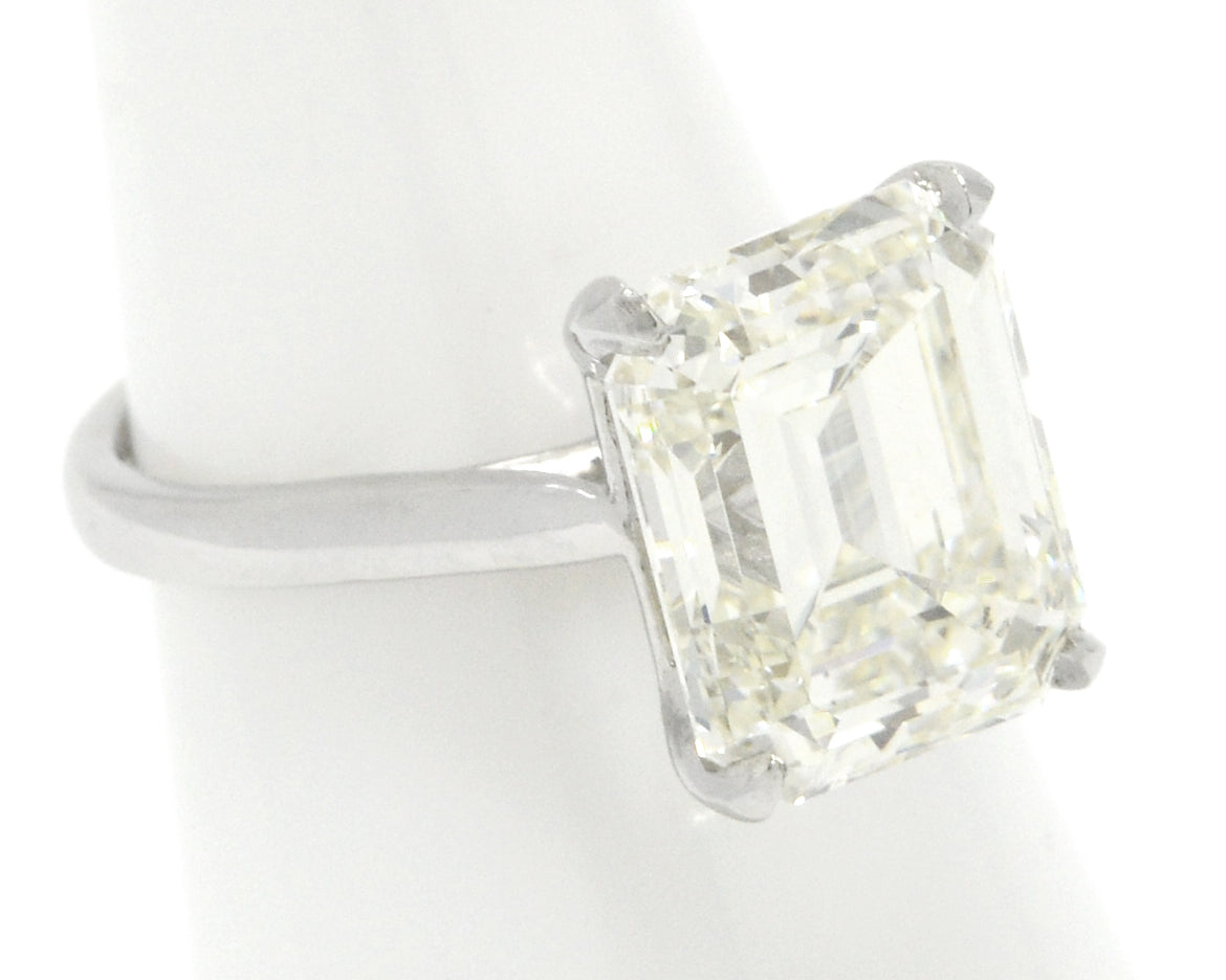 An 8 carat emerald cut diamond in a platinum setting.