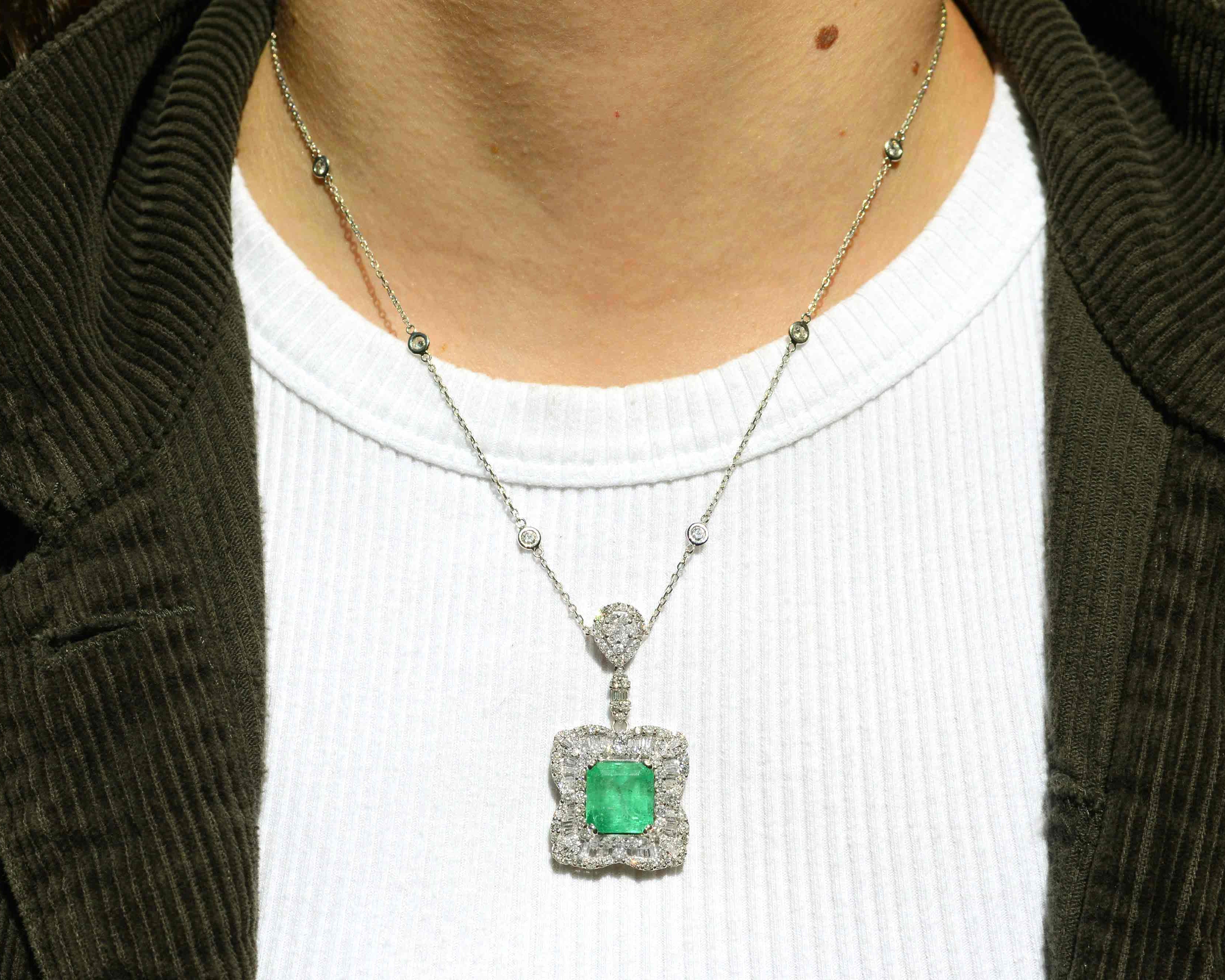 A vivid, grass green 7.90 carat emerald necklace with 3 carats of diamonds.
