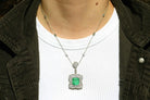 A vivid, grass green 7.90 carat emerald necklace with 3 carats of diamonds.
